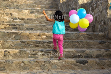 Fair Trade Photo Activity, Balloon, Birthday, Colour image, Confirmation, Day, Growth, Horizontal, One girl, Outdoor, Party, People, Peru, South America, Stairs, Summer, Walking