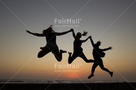 Fair Trade Photo Activity, Beach, Colour image, Evening, Friendship, Group of children, Horizontal, Jumping, People, Shooting style, Silhouette, Summer, Sunset