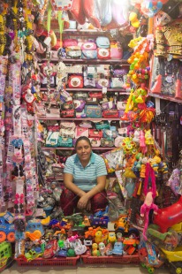 Fair Trade Photo Activity, Colour image, Entrepreneurship, Ethnic-folklore, Food and alimentation, Looking at camera, Market, One woman, People, Peru, Portrait fullbody, Selling, Smiling, South America, Vertical