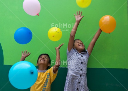 Fair Trade Photo Activity, Balloon, Colour image, Emotions, Friendship, Happiness, Horizontal, Party, People, Peru, Playing, Smiling, South America, Together, Two children