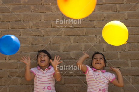 Fair Trade Photo Activity, Balloon, Colour image, Emotions, Friendship, Happiness, Horizontal, Party, People, Peru, Playing, Smiling, South America, Together, Twin, Two girls