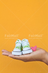 Fair Trade Photo Birth, Birthday, Colour image, Hand, Love, New baby, Peru, Red, Shoe, South America, Tarapoto travel, Valentines day, Vertical, Wood, Yellow