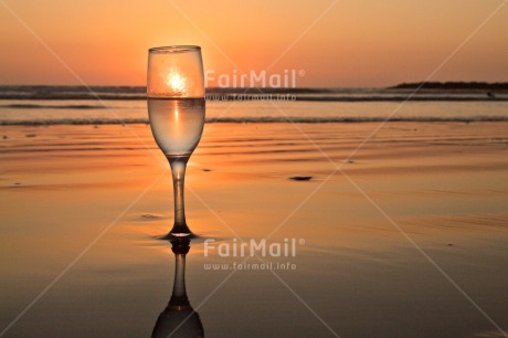 Fair Trade Photo Beach, Colour image, Food and alimentation, Fruits, Glass, Horizontal, Orange, Peru, Reflection, Sea, South America, Sunset, Water