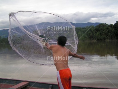 Fair Trade Photo Activity, Boat, Colour image, Day, Fisheries, Fishing, Horizontal, One man, Outdoor, People, Peru, River, Rural, South America, Water, Working