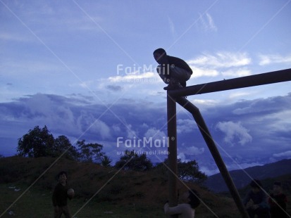 Fair Trade Photo Activity, Colour image, Emotions, Evening, Group of boys, Growth, Horizontal, One boy, Outdoor, People, Peru, Rural, Sitting, Sky, South America, Sport, Thinking of you