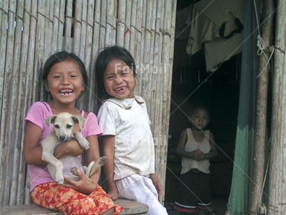 Fair Trade Photo Activity, Animals, Colour image, Cute, Dailylife, Dog, Emotions, Family, Friendship, Happiness, Horizontal, Looking at camera, Multi-coloured, Outdoor, People, Peru, Portrait halfbody, Rural, Sitting, Smile, Smiling, South America, Together, Tooth, Two children, Two girls