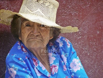 Fair Trade Photo Activity, Blue, Clothing, Colour image, Funny, Hat, Horizontal, Looking at camera, Old age, One woman, Outdoor, People, Peru, Portrait headshot, Red, Retirement, Rural, Sombrero, South America, Streetlife, White, Wisdom