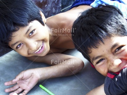 Fair Trade Photo 10-15 years, Activity, Colour image, Education, Emotions, Friendship, Fun, Happiness, Horizontal, Latin, Looking at camera, People, Peru, Playing, Portrait halfbody, Smile, Smiling, South America, Together, Two boys