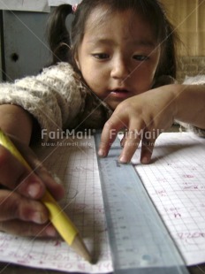 Fair Trade Photo Activity, Child labour, Colour image, Day, Education, Exams, Good luck, Indoor, Looking away, One girl, Pencil, People, Peru, Portrait headshot, School, Social issues, South America, Studying, Vertical, Wisdom, Writing