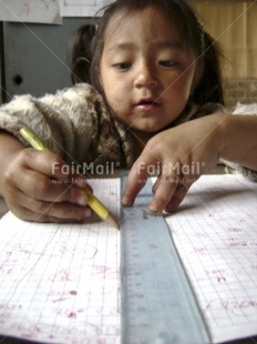 Fair Trade Photo Activity, Child labour, Colour image, Day, Education, Exams, Girl, Good luck, Indoor, Looking away, One girl, Pencil, People, Peru, Portrait headshot, School, Social issues, South America, Studying, Vertical, Wisdom, Writing