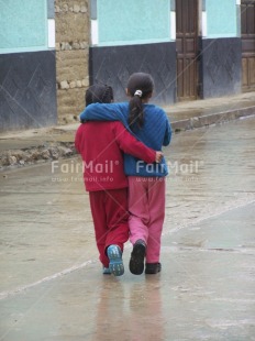 Fair Trade Photo Activity, Blue, Casual clothing, Clothing, Colour image, Colourful, Cooperation, Dailylife, Day, Friendship, Outdoor, People, Peru, Portrait fullbody, Red, South America, Street, Streetlife, Together, Two children, Two girls, Vertical, Walking