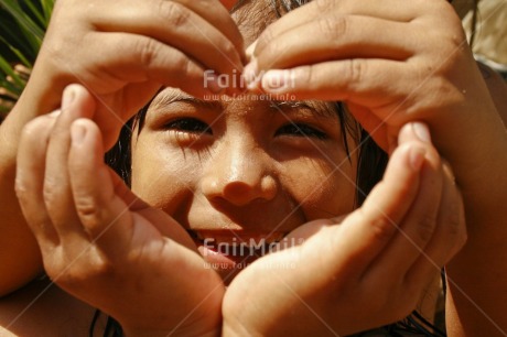 Fair Trade Photo 55-60 years, Activity, Colour image, Cooperation, Emotions, Friendship, Hand, Happiness, Heart, Horizontal, Latin, Looking at camera, Love, One girl, People, Peru, Portrait headshot, Smiling, South America, Thinking of you, Together, Two children, Valentines day