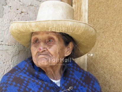 Fair Trade Photo 55-60 years, Activity, Clothing, Colour image, Day, Hat, Horizontal, Latin, Looking away, Old age, One woman, Outdoor, People, Peru, Portrait headshot, Rural, Sombrero, South America, Street, Streetlife, Traditional clothing