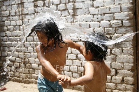 Fair Trade Photo 5-10 years, Activity, Bathing, Bucket, Cleaning, Colour image, Dailylife, Day, Emotions, Friendship, Happiness, Horizontal, Hygiene, Joy, Multi-coloured, Outdoor, People, Peru, Playing, Portrait halfbody, Sanitation, Showering, Social issues, South America, Together, Two children, Washing, Water