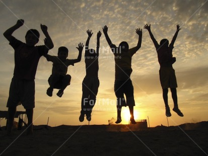 Fair Trade Photo Activity, Backlit, Beach, Colour image, Emotions, Friendship, Group of boys, Group of children, Happiness, Horizontal, Jumping, Outdoor, People, Peru, Playing, Sand, Silhouette, South America, Sun, Sunset, Together
