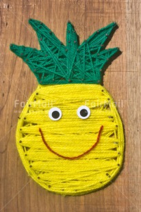 Fair Trade Photo Colour image, Crafts, Food and alimentation, Fruits, Grass, Green, Holiday, Peru, Pineapple, Seasons, Smile, Smiling, South America, Summer, Vertical, Wood, Wool, Yellow