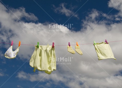 Fair Trade Photo Activity, Baby, Clothing, Clouds, Day, Drying, Horizontal, New baby, Outdoor, People, Peru, Sky, South America, Summer, Washingline, Yellow