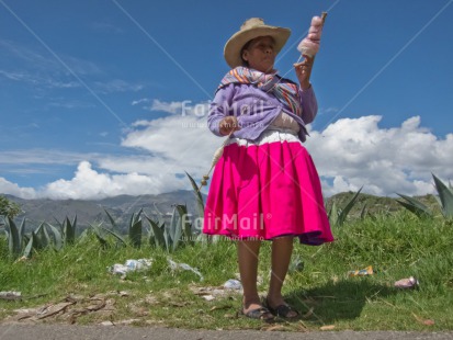 Fair Trade Photo Activity, Agriculture, Clothing, Day, Ethnic-folklore, Farmer, Horizontal, Mountain, One woman, Outdoor, People, Peru, Pink, Rural, Sombrero, South America, Streetlife, Traditional clothing, Weaving