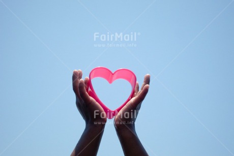 Fair Trade Photo Beach, Closeup, Colour image, Day, Flower, Hand, Heart, Horizontal, Love, Outdoor, Peru, Pink, Sand, Sky, South America, Summer, Valentines day