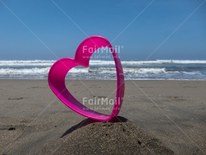 Fair Trade Photo Beach, Closeup, Colour image, Day, Flower, Heart, Horizontal, Love, Outdoor, Peru, Pink, Sand, Sea, South America, Summer, Valentines day, Water