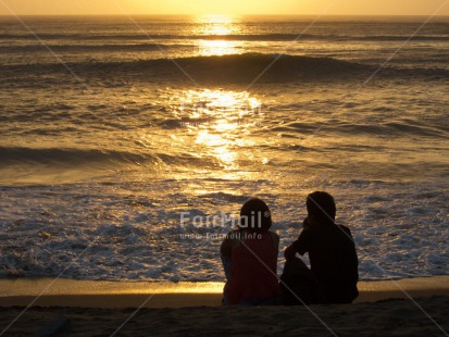 Fair Trade Photo Activity, Backlit, Beach, Colour image, Couple, Evening, Friendship, Horizontal, Love, One man, One woman, Outdoor, People, Peru, Romantic, Sea, Seasons, Silhouette, Sitting, South America, Summer, Together, Two people