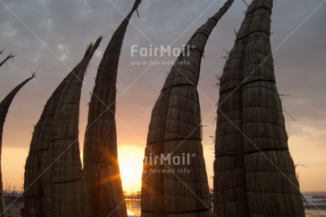 Fair Trade Photo Backlit, Beach, Clouds, Colour image, Ethnic-folklore, Evening, Fishing boat, Horizontal, Huanchaco, Outdoor, Peru, Sea, Silhouette, South America, Sunset