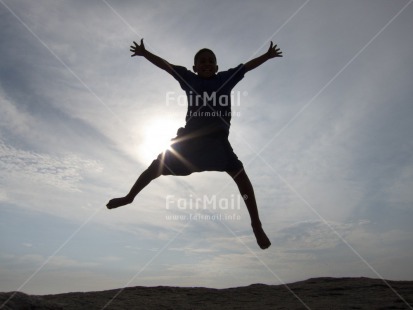Fair Trade Photo 10-15 years, Activity, Clouds, Colour image, Confirmation, Day, Freedom, Horizontal, Jumping, Light, Low angle view, One boy, Outdoor, People, Peru, South America, Sport, Sun, Yoga