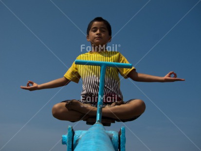 Fair Trade Photo Activity, Blue, Casual clothing, Clothing, Colour image, Funny, Horizontal, Meditating, One boy, Outdoor, People, Peru, Playground, Sky, South America, Yoga