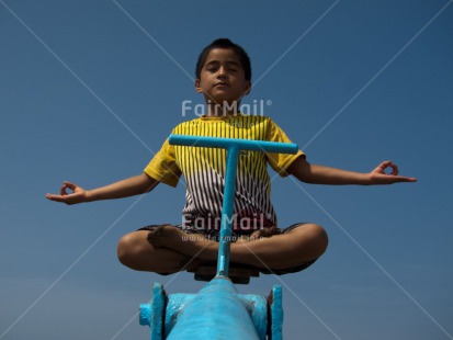Fair Trade Photo Activity, Blue, Casual clothing, Clothing, Colour image, Funny, Horizontal, Meditating, One boy, Outdoor, People, Peru, Playground, Sky, South America, Yoga