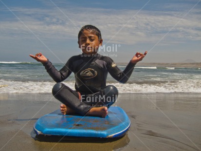 Fair Trade Photo 5 -10 years, Activity, Beach, Colour image, Horizontal, Latin, Meditating, One boy, People, Peru, Sand, Sea, South America, Sport, Summer, Surfboard, Water, Yoga