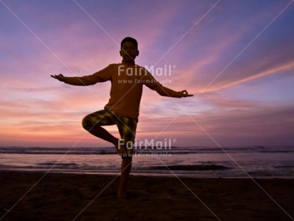 Fair Trade Photo 10-15 years, Activity, Backlit, Beach, Clouds, Colour image, Evening, Horizontal, Latin, One boy, Outdoor, People, Peru, Sea, Silhouette, South America, Sunset, Water, Yoga