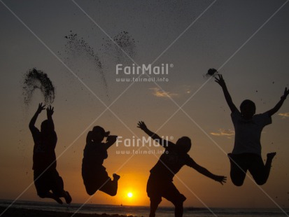 Fair Trade Photo Activity, Backlit, Beach, Colour image, Emotions, Evening, Friendship, Group of boys, Group of children, Happiness, Horizontal, Jumping, Outdoor, People, Peru, Sea, Silhouette, South America, Sunset, Water