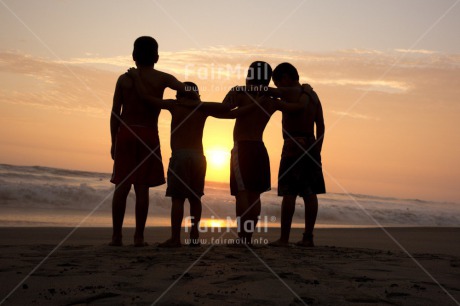 Fair Trade Photo 5 -10 years, Activity, Beach, Colour image, Emotions, Evening, Friendship, Group of boys, Happiness, Horizontal, Latin, Outdoor, People, Peru, Playing, Sea, Silhouette, South America, Sunset, Together