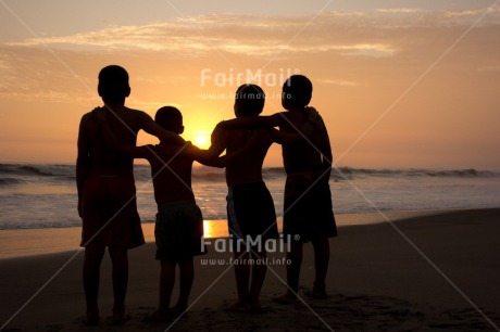Fair Trade Photo 5 -10 years, Activity, Beach, Colour image, Emotions, Evening, Friendship, Group of boys, Happiness, Horizontal, Latin, Outdoor, People, Peru, Playing, Sea, Silhouette, South America, Sunset, Together