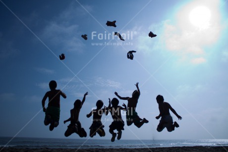 Fair Trade Photo Activity, Backlit, Beach, Colour image, Cooperation, Emotions, Evening, Freedom, Friendship, Group of boys, Happiness, Jumping, Outdoor, People, Peru, Playing, Silhouette, Sky, South America, Sunset, Throwing, Together