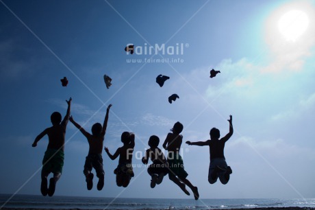 Fair Trade Photo Activity, Backlit, Beach, Colour image, Cooperation, Emotions, Evening, Freedom, Friendship, Group of boys, Happiness, Jumping, Outdoor, People, Peru, Playing, Silhouette, Sky, South America, Sunset, Throwing, Together