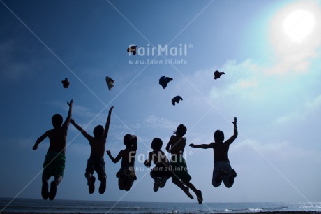 Fair Trade Photo Activity, Backlit, Beach, Colour image, Cooperation, Emotions, Evening, Freedom, Friendship, Group of boys, Happiness, Jumping, Outdoor, People, Peru, Playing, Silhouette, Sky, South America, Sunset, Throwing, Together