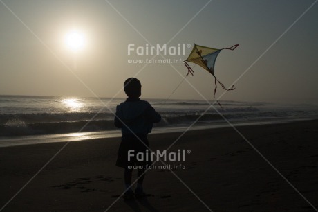 Fair Trade Photo Activity, Backlit, Beach, Colour image, Evening, Freedom, Kite, One boy, Outdoor, People, Peru, Playing, Sea, Silhouette, Sky, South America, Wind