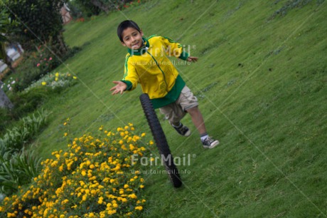 Fair Trade Photo 5 -10 years, Activity, Casual clothing, Clothing, Colour image, Dailylife, Day, Emotions, Green, Happiness, Latin, Outdoor, Park, People, Peru, Playing, Portrait fullbody, Running, South America, Streetlife, Yellow