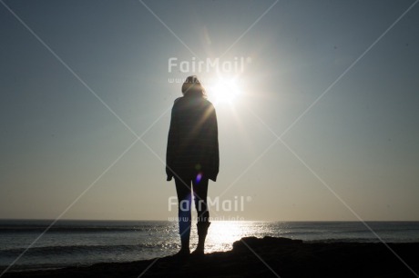 Fair Trade Photo Backlit, Beach, Colour image, Emotions, Evening, Light, Loneliness, One woman, Outdoor, People, Peru, Sea, Silhouette, South America, Summer, Sun, Sunset, Thinking of you