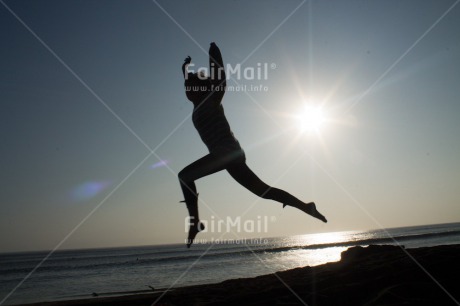 Fair Trade Photo Activity, Backlit, Beach, Colour image, Emotions, Evening, Jumping, Light, Loneliness, One woman, Outdoor, People, Peru, Sea, Silhouette, South America, Summer, Sun, Sunset, Thinking of you