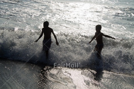 Fair Trade Photo Activity, Backlit, Beach, Emotions, Evening, Friendship, Happiness, Horizontal, Outdoor, People, Peru, Playing, Sea, Silhouette, South America, Together, Two boys