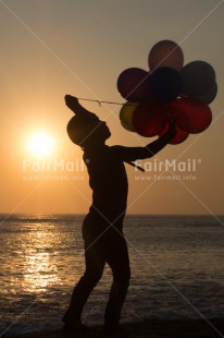 Fair Trade Photo 5 -10 years, Activity, Balloon, Beach, Emotions, Evening, Happiness, One boy, Outdoor, People, Peru, Playing, South America, Sunset, Vertical