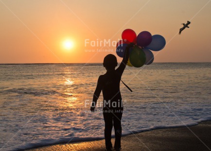 Fair Trade Photo 5 -10 years, Activity, Balloon, Beach, Emotions, Evening, Happiness, Horizontal, One boy, Outdoor, People, Peru, Playing, South America, Sunset