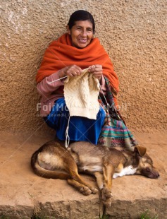 Fair Trade Photo Activity, Animals, Colour image, Dailylife, Dog, Knitting, Latin, One woman, People, Peru, Portrait fullbody, Rural, Sitting, Smiling, South America, Streetlife, Vertical