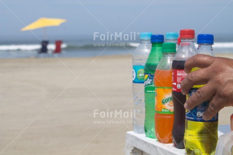 Fair Trade Photo Beach, Closeup, Colour image, Entrepreneurship, Food and alimentation, Hand, Horizontal, Huanchaco, Latin, One man, People, Peru, Sea, Seasons, Selling, South America, Summer