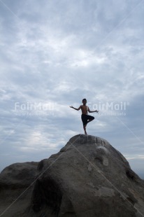 Fair Trade Photo 10-15 years, Clouds, Colour image, One boy, Outdoor, People, Peru, Sky, South America, Stone, Vertical, Yoga