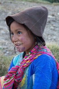 Fair Trade Photo 5 -10 years, Activity, Clothing, Colour image, Ethnic-folklore, Latin, Looking away, One girl, Outdoor, People, Peru, Rural, Smiling, South America, Traditional clothing, Vertical