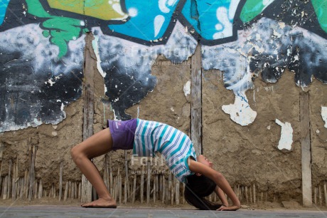 Fair Trade Photo Activity, Bridge, Colour image, Graffity, Health, Horizontal, Meditating, One girl, Outdoor, Peace, People, Peru, South America, Urban, Wellness, Yoga