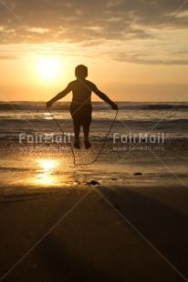 Fair Trade Photo Activity, Beach, Colour image, Emotions, Evening, Happiness, Jumping, Outdoor, Peru, Playing, Shooting style, Silhouette, South America, Summer, Sunset, Vertical